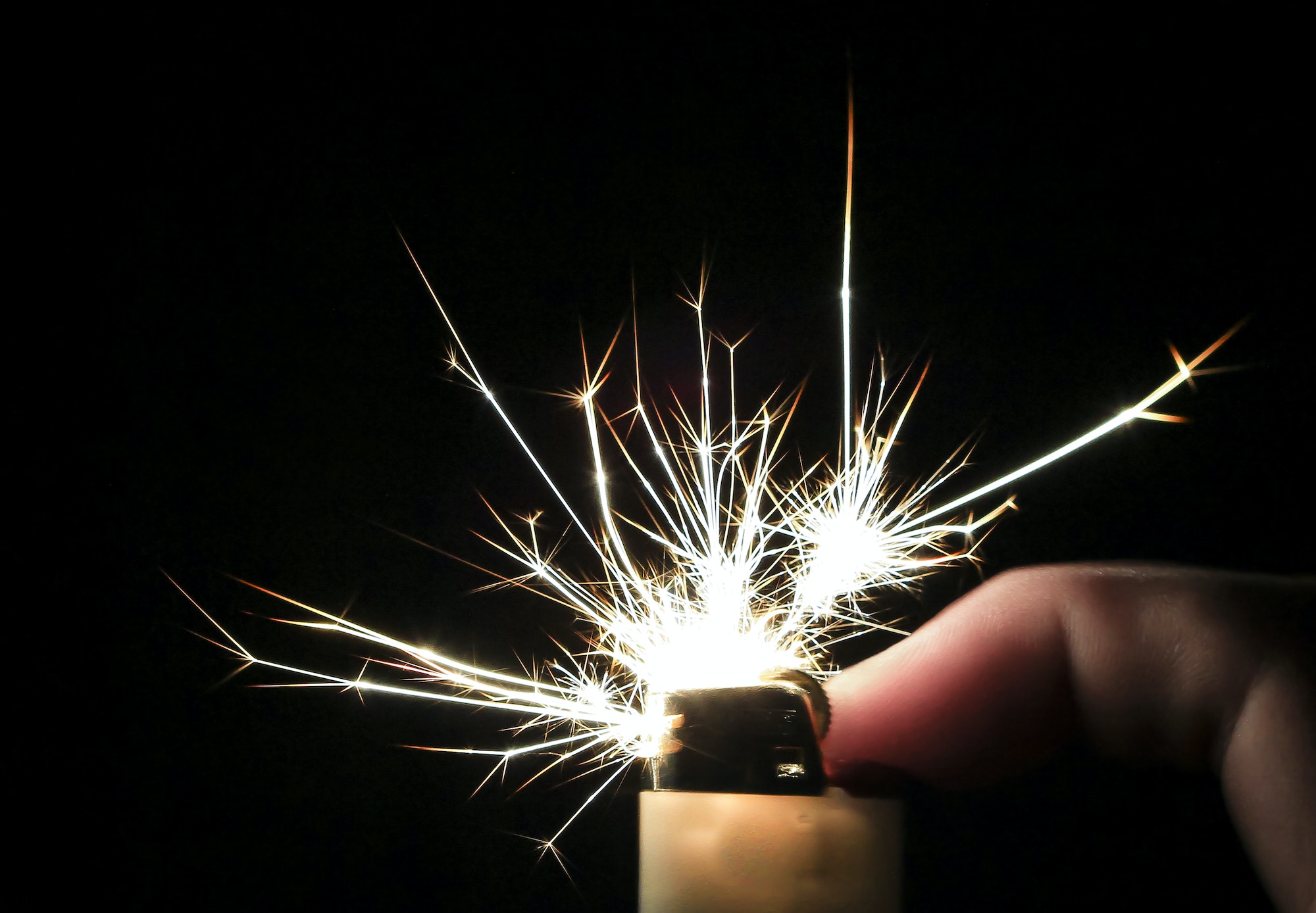 Long Sparks Shoot From a Cigarette Lighter